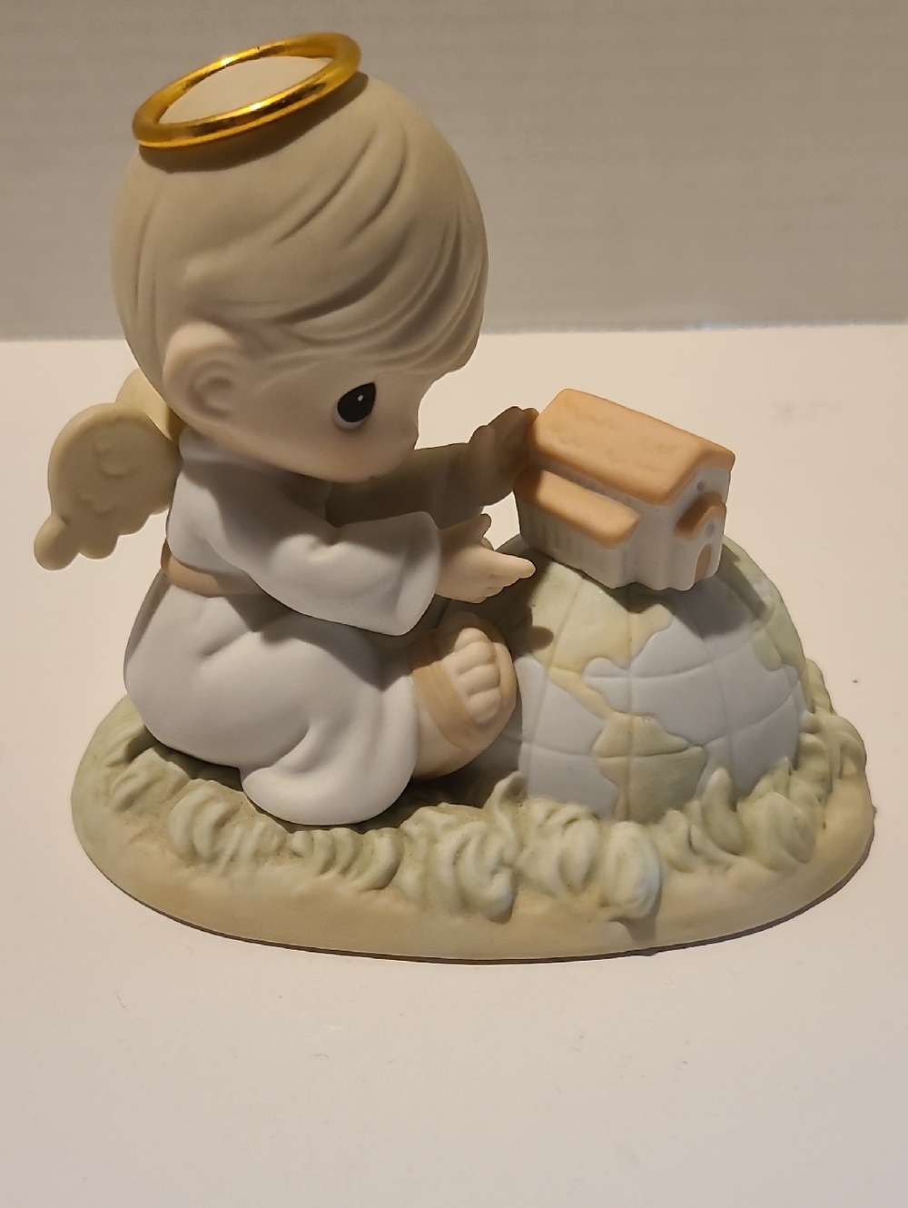Precious Moments Angel with Globe - Chapel Exclusive- Signed By Sam Butcher